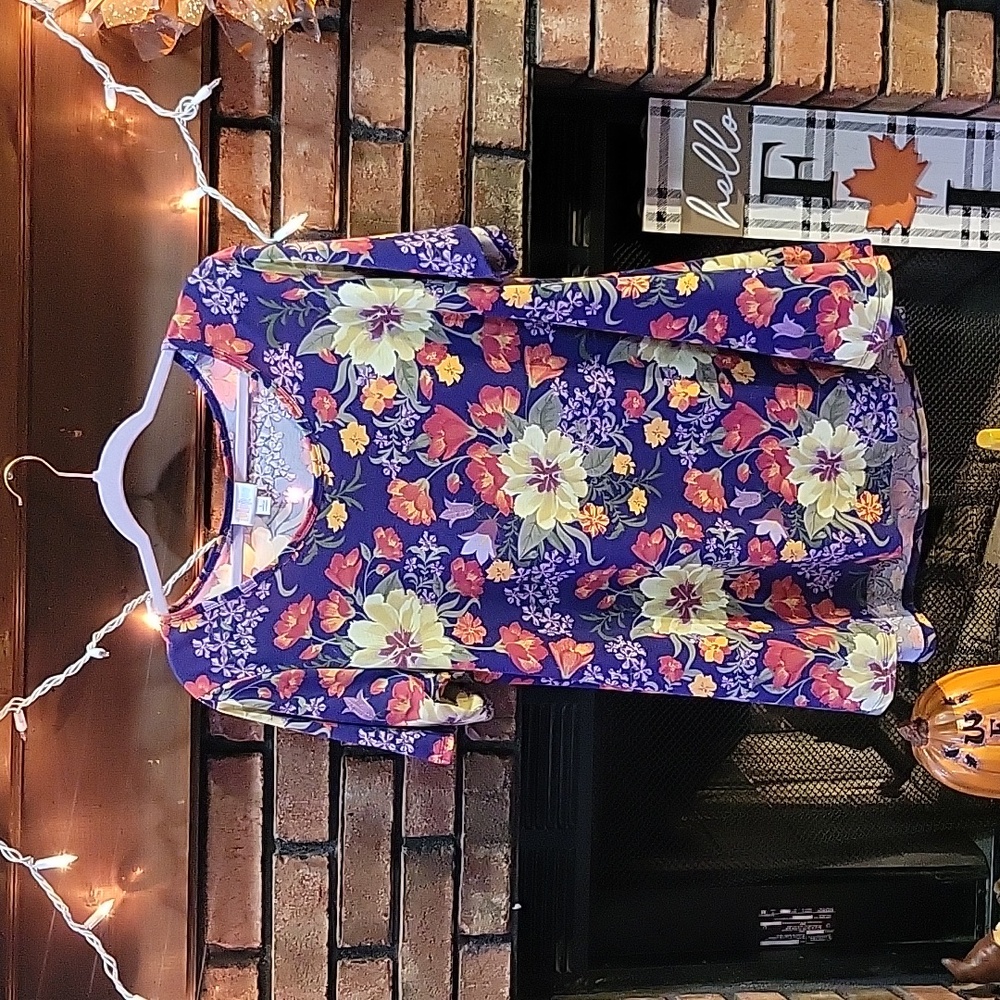 LulaRoe  pretty purple yellow and orange shirt. Size large.